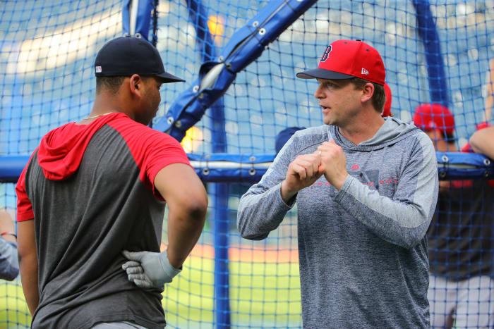Jun 4, 2019; Kansas City, MO, USA; Boston Red Sox hitting coach Tim Hyers (51) talks with third baseman Rafael Devers (11) during batting practice before the game against the Kansas City Royals at Kauffman Stadium. Mandatory Credit: Jay Biggerstaff-USA TODAY Sports